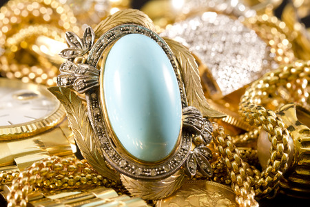 Closeup of gold jewelery with precious stonesの写真素材