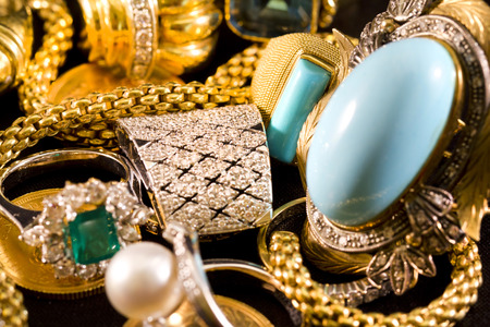 Closeup of gold jewelery with precious stonesの写真素材