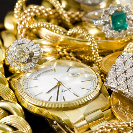 Closeup of gold jewelery with precious stonesの写真素材