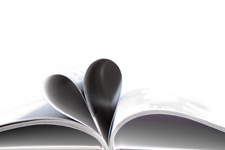 Embossed pages of book folded to make heart on white backgroundの写真素材