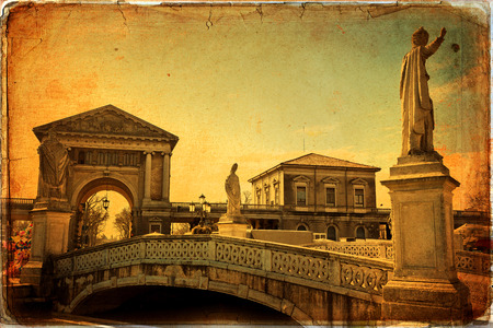 View of the canal with statues on Prato della Valle in Padova, Veneto, Italy. Texture retroの写真素材