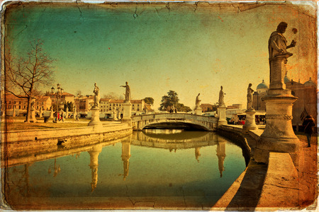 View of the canal with statues on Prato della Valle in Padova, Veneto, Italy. Texture retroの写真素材