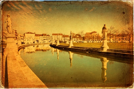 View of the canal with statues on Prato della Valle in Padova, Veneto, Italy. Texture retroの写真素材