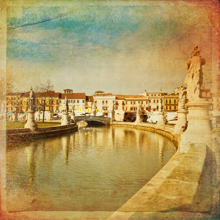 View of the canal with statues on Prato della Valle in Padova, Veneto, Italy. Texture retroの写真素材