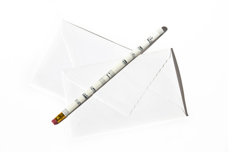 Two white envelopes with pencil on a white background