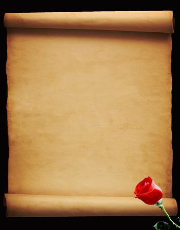 Old vintage parchment isolated on black backgroundの写真素材