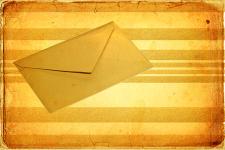 Gold envelope isolated on a texture retroの写真素材