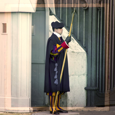ROME, ITALY, NOVEMBER 26, 2011: Famous Swiss Guard on JUNE 03, 2010 in Vatican. The Papal Guard standing at the door of Vatican Museum.のeditorial素材