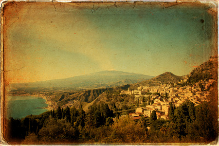 Traditional Sicilian village Taormina with view on Etna volcanoの写真素材