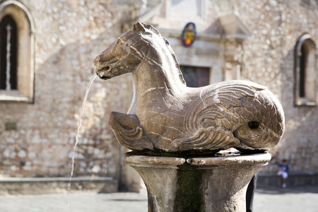 The cathedral of St. Nicola and the Tauro fountain in Taormina, Sicilyの写真素材