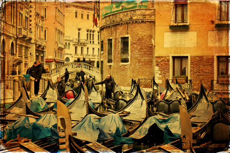 Gondolier on a gondola on the Grand Canal in Venice. Gondola's are a major mode of touristic transport in Venice, Italy.のeditorial素材