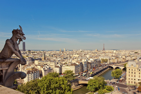 Notre Dame of Paris: Famous Chimera, demon, overlooking the Eiffel Tower at a summer dayのeditorial素材