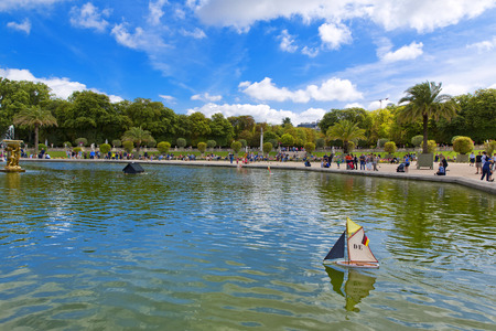 PARIS, FRANCE, August 9, 2014: Luxembourg Palace and octagonal basin. The Jardin du Luxembourg is the second largest public park in Paris, France. The park is the garden of the French Senateのeditorial素材