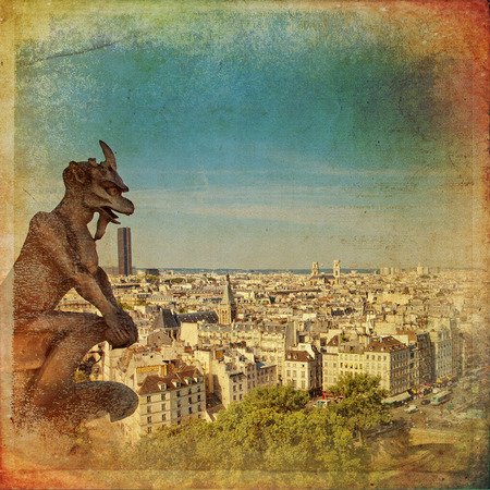 Notre Dame of Paris: Famous Chimera, demon, overlooking the Eiffel Tower at a summer day in vintage styleの写真素材