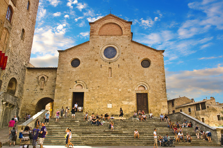 SAN GIMIGNANO, ITALY, August 7, 2011: Buildings and towers in Piazza del Duomo, San Gimignano medieval town (UNESCO heritage), Siena, Tuscany, Italyの写真素材