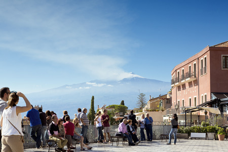 TAORMINA, SICILY, November 3, 2012: Traditional Sicilian village Taormina with view on Etna volcanoのeditorial素材