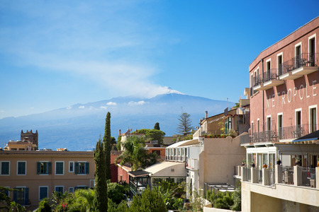 TAORMINA, SICILY, November 3, 2012: Traditional Sicilian village Taormina with view on Etna volcanoのeditorial素材