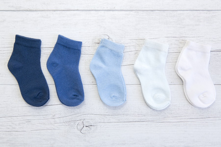 Baby socks with different shades of blue, top view