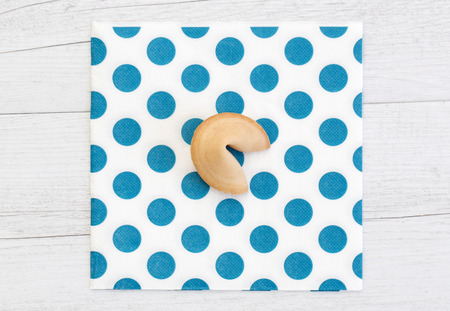 Photo of an isolated fortune cookie on a backgroundの写真素材