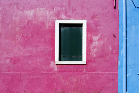 Picturesque windows with shutters on the famous island Burano, Venice, Italyの写真素材