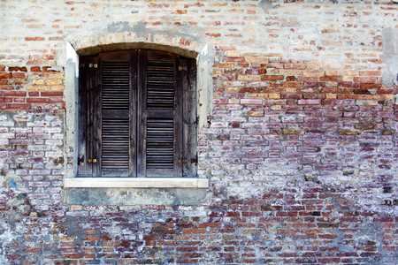 Picturesque windows with shutters on the famous island Burano, Venice, Italyの写真素材