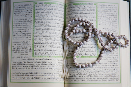 Holy Islamic old book Quran opened and isolated