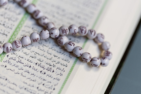 Holy Islamic old book Quran opened and isolatedの写真素材