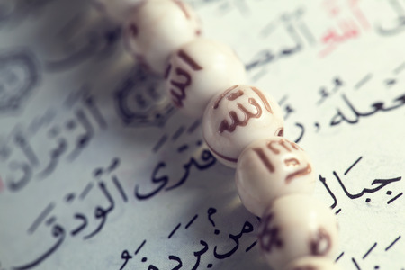 Holy Islamic old book Quran opened and isolated