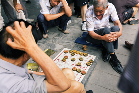 Seniors playing checkers in the Temple of Heaven in Beijing, Chinaのeditorial素材