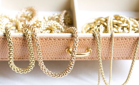 Closeup of gold jewelery with precious stonesの写真素材