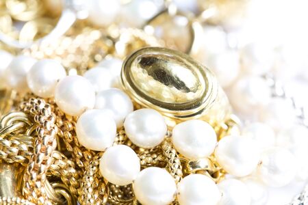 Closeup of gold jewelery with precious stonesの写真素材
