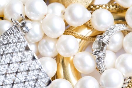 Closeup of gold jewelery with precious stonesの写真素材