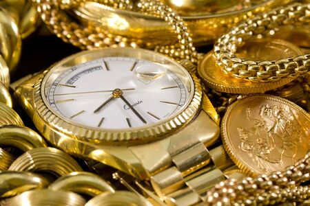Closeup of gold jewelery with precious stonesの写真素材