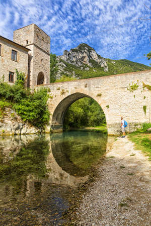 San Vittore alle Chiuse. Roman Catholic abbey and church. The edifice is known from the year 1011. Ponte Romano. Roman bridge over a small river. Italy. Marche. Ancona.のeditorial素材