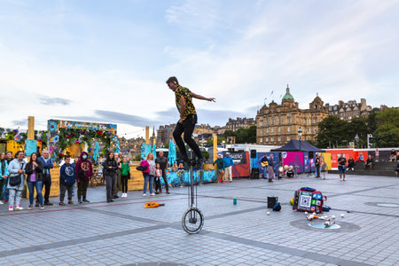 EDINBURGH, SCOTLAND 2022, August 21: street artist performs in an Edinburgh square