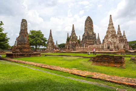 The well-preserved ruins of Wat Chaiwatthanaram in Ayutthaya, Thailand, featuring its iconic Khmer-style prangs and surrounding greeneryの写真素材