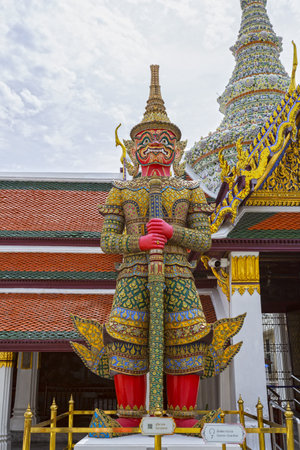 A colorful demon guardian statue at the Grand Palace in Bangkokの写真素材