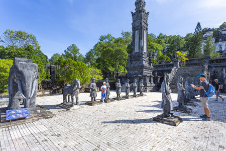 HUE, VIETNAM, August 16, 2024: Tourists explore the courtyard of the Tomb of Khai Dinh in Hue, Vietnamの写真素材