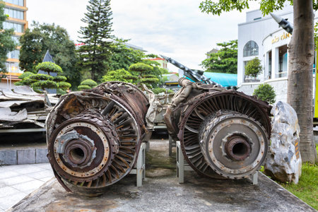 Damaged jet engines and b-52 Victory Museum building in Hanoi, Vietnamの写真素材