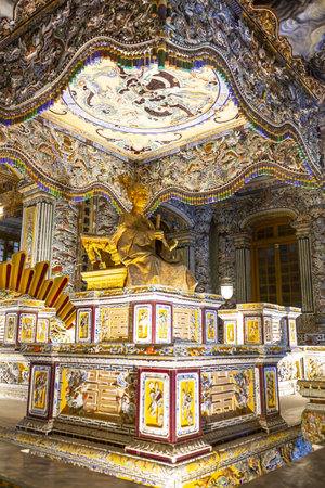 The richly decorated interior of the main hall, Thien Dinh Palace, at Khai Dinh Tomb in HUE, Vietnam