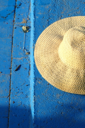summer straw hat on a blue backgroundの写真素材