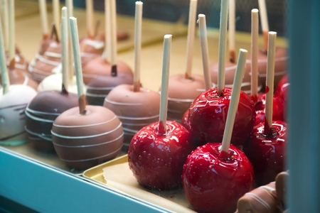 Candied apples on a stick at a fairの写真素材