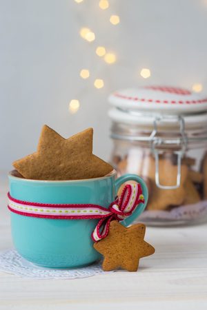 traditional tasty homemade gingerbread in a glass jar on bokeh backgroundの写真素材