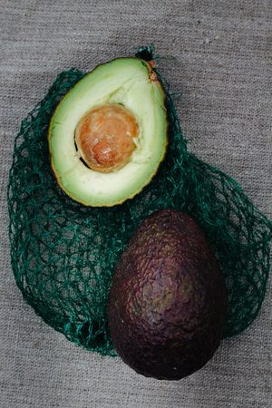 organic avocados on a green gridの写真素材