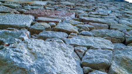 A closeup shot of a cobblestone road in the countrysideの写真素材