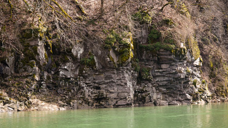 A panoramic shot of a river flowing through a rocky gorge