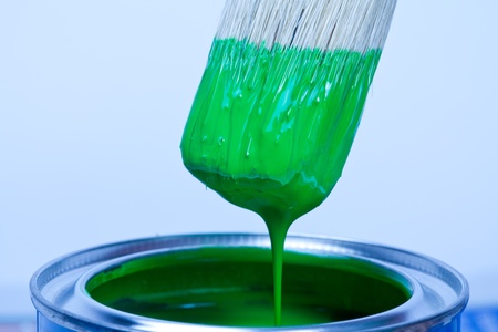 Green paint can and brushの写真素材