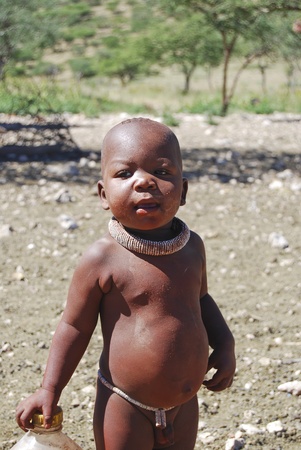 KAOKOLAND NAMIBIA - MAY 4: Unidentified child near Opuwo on May 4, 2008, Namibia. Himbas are the last Nomadic People in Namibia - there are only about 7000 leftのeditorial素材