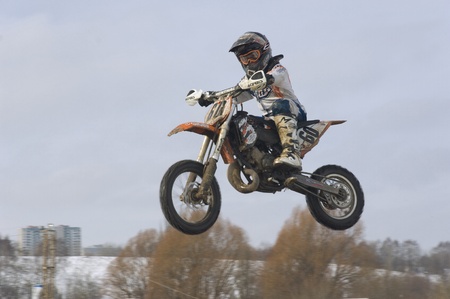 MOSCOW - FEBRUARY 28: Unrecognised sportsman on a second tour of motocross of Red Racing Group club on February 28, 2010 in Moscow, Krilatskoe, Russiaのeditorial素材