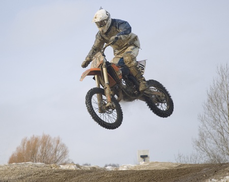 MOSCOW - FEBRUARY 28: Unrecognised sportsman on a second tour of motocross of Red Racing Group club on February 28, 2010 in Moscow, Krilatskoe, Russia のeditorial素材